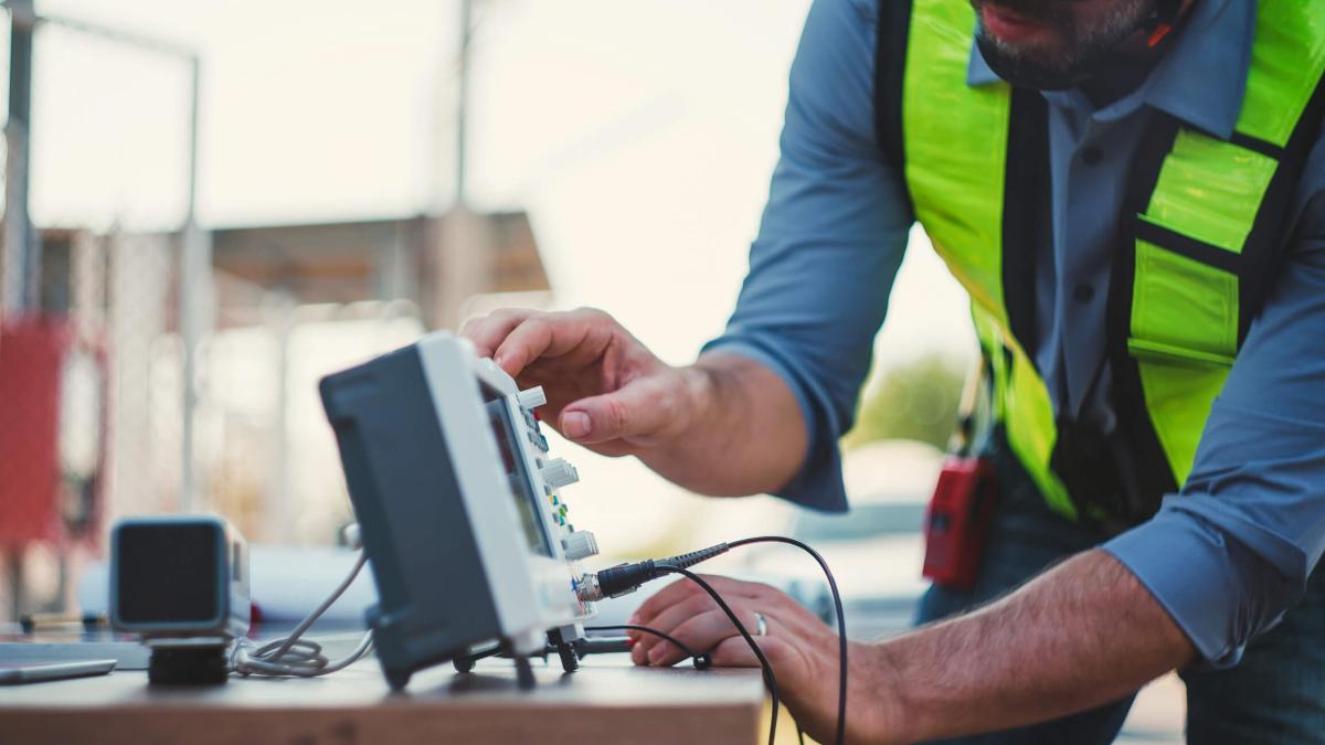 man working on a electric box